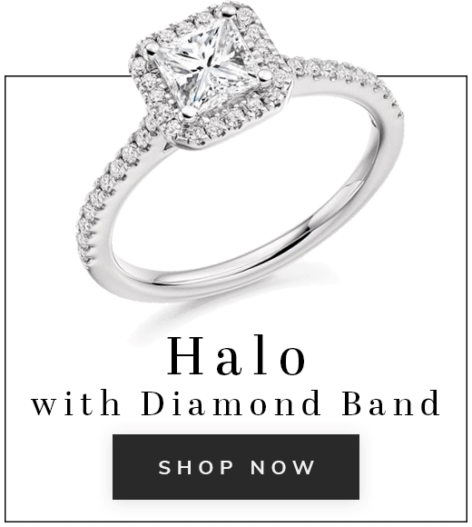 Halo engagement ring with diamond band on white background with text halo with diamond band shop now