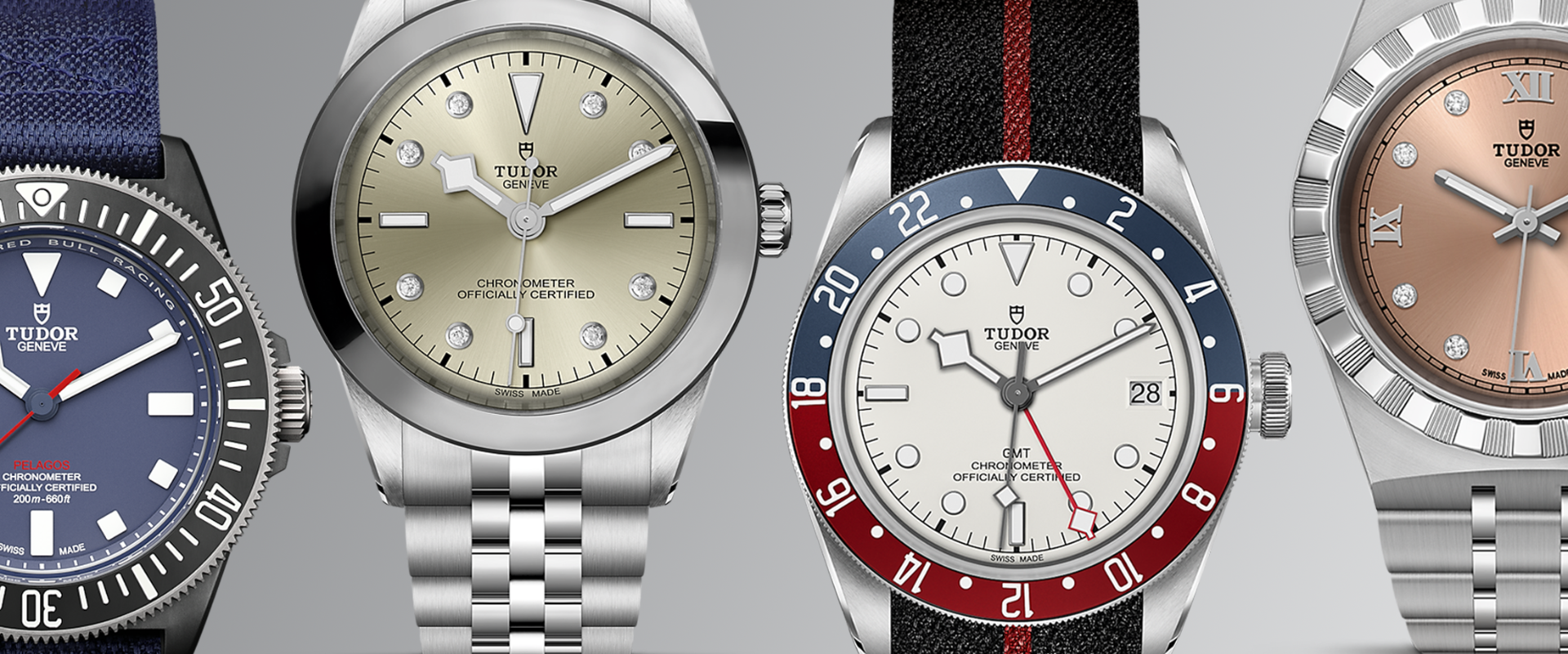 Various Tudor watches on a grey background